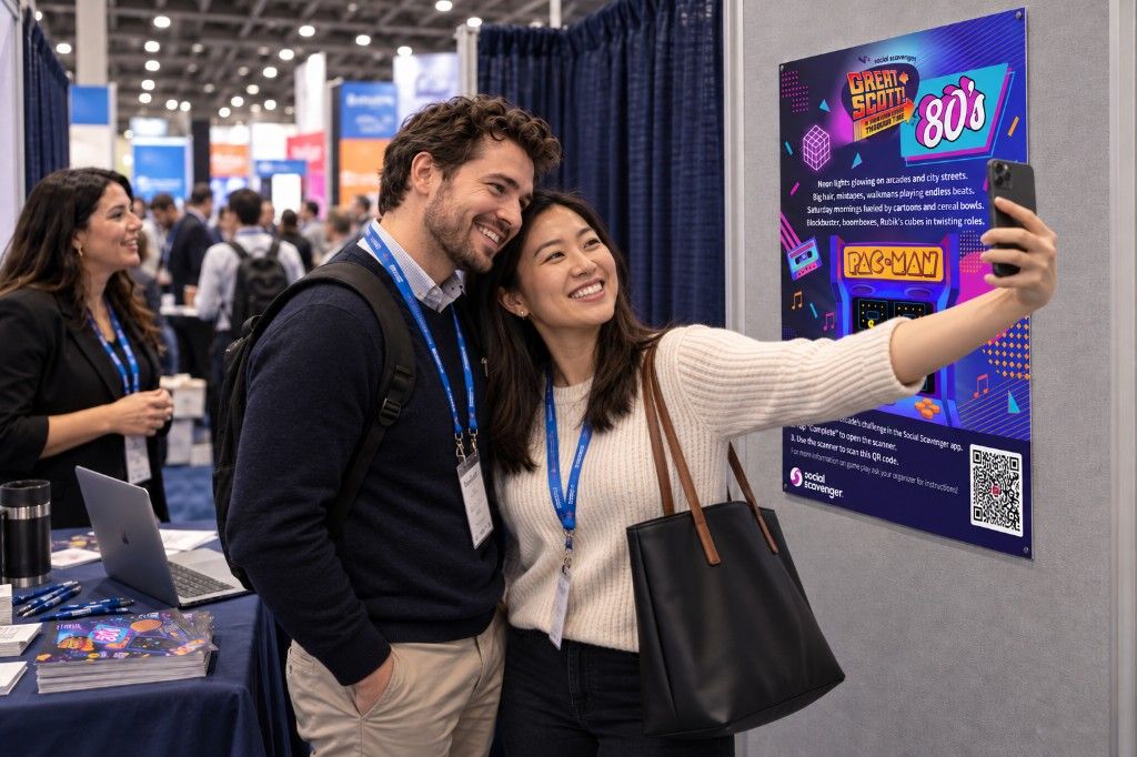 Two attendees taking a selfie during a booth photo challenge