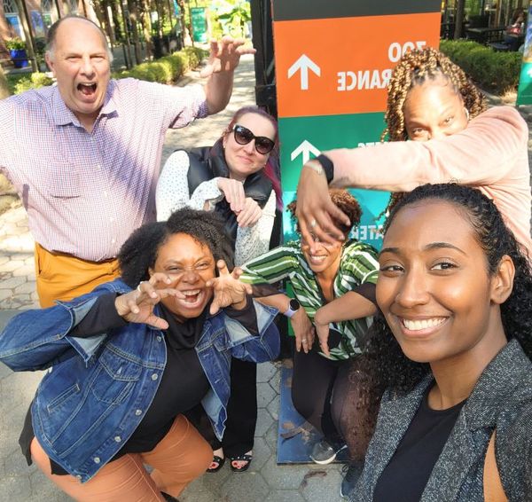 Team laughing during an in-person Social Scavenger game