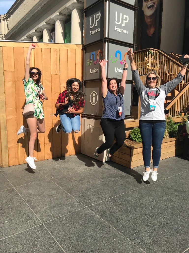 Team jumping outside Union Station during a scavenger hunt