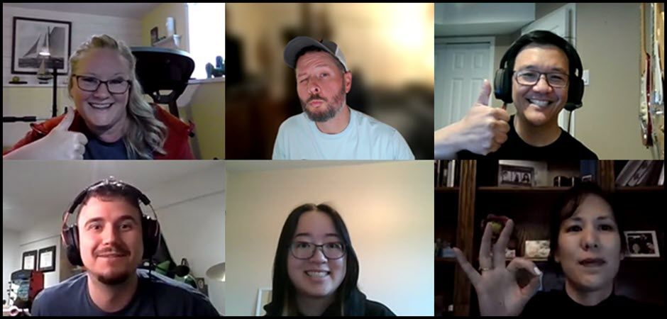 Virtual team trivia participants giving thumbs up on a video call